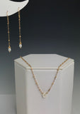 Side to Side Gold Pearl Necklace